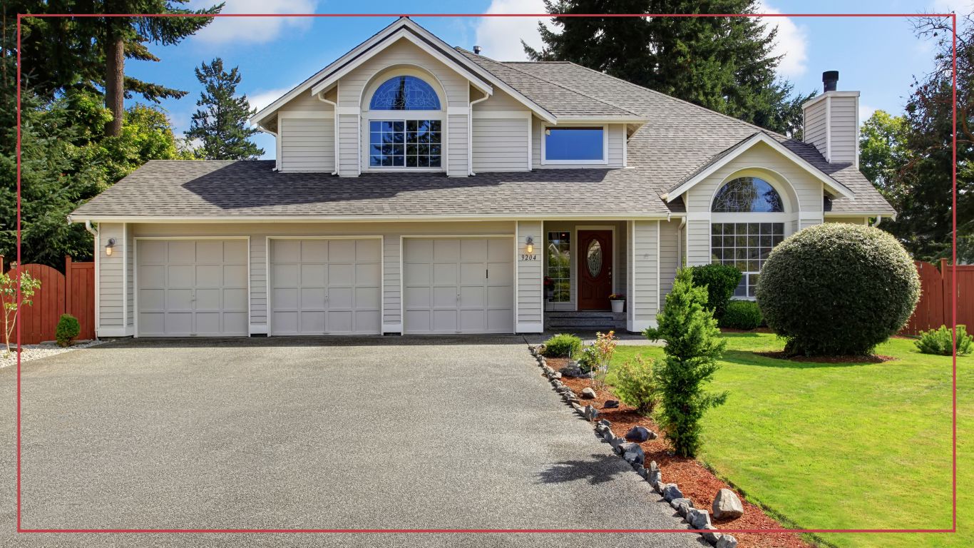 House with three car garage and front yard landscape