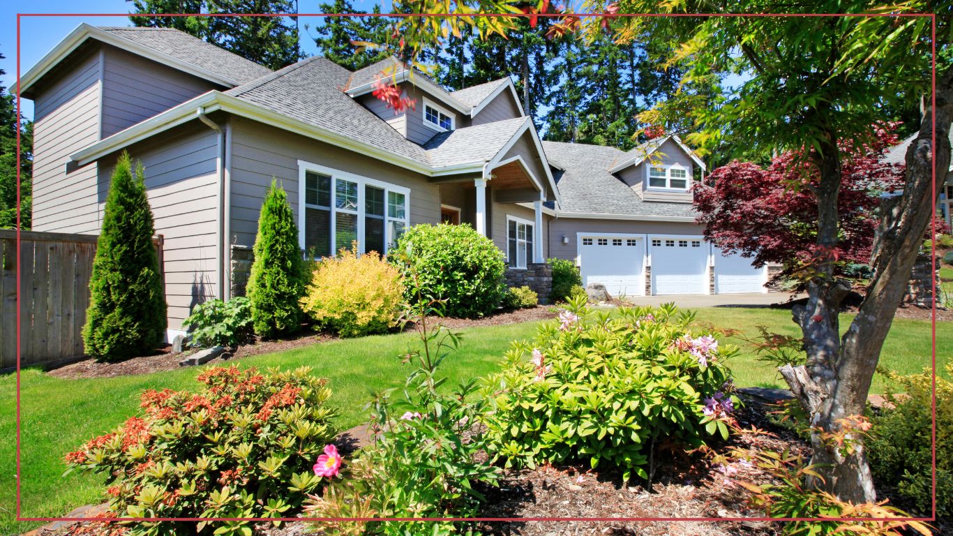 Beautiful curb appeal of classic Downriver home with nice landscape design of the front yard.